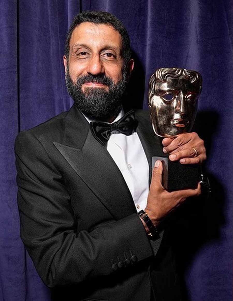 Adeel Akhtar wore a black suit as he showed off his Award for Best Supporting Actor for Sherwood