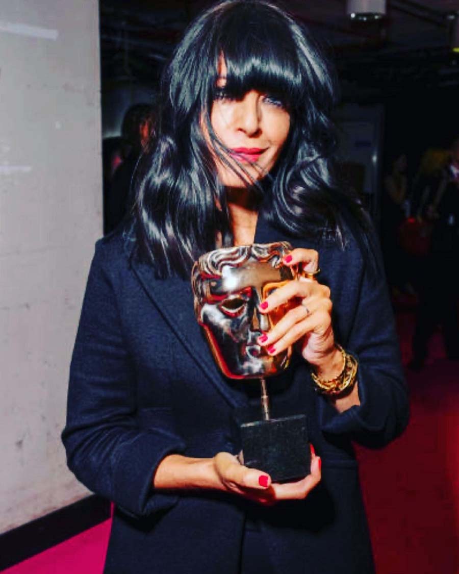 Claudia Winkleman rocked a jacket that had ‘Faithful’ written on the back. She posed with the Entertainment Performance Award for The Traitors.