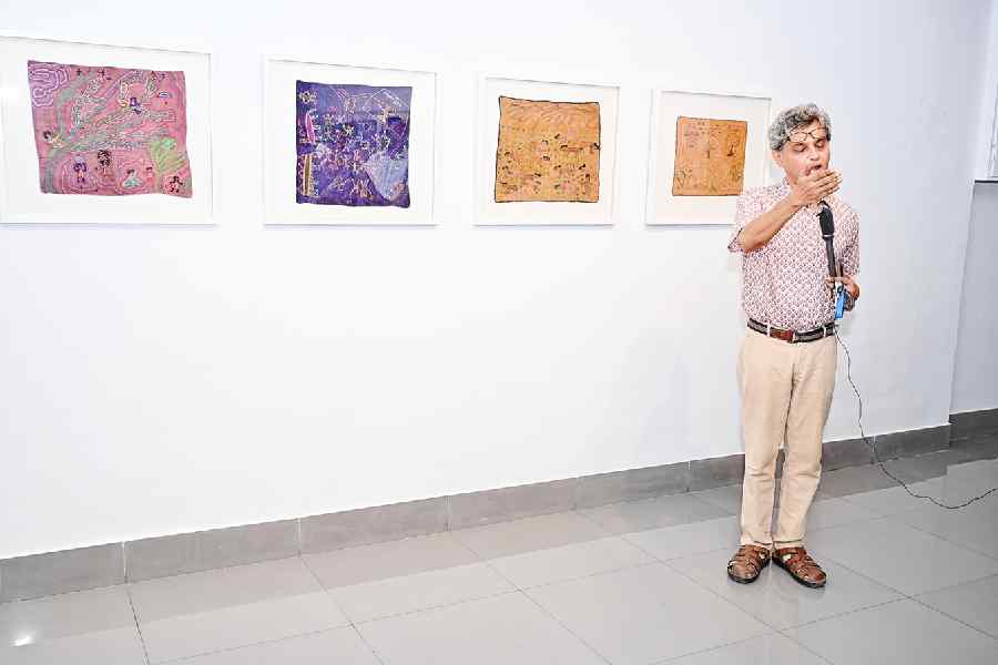 Adip Dutta addressing the audience at Stitched Paintings
