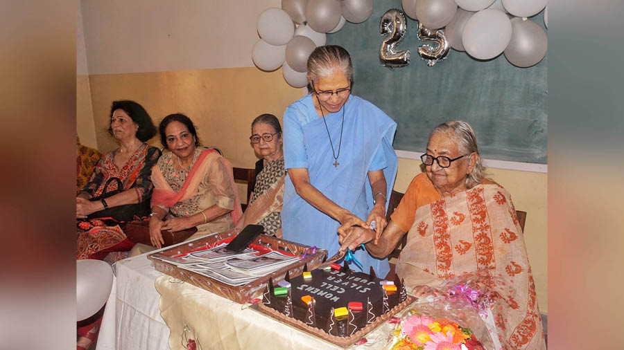 Principal Sister Christine Coutinho and (right) Usha Bubna, the founder of the Women’s Cell, cut a cake to celebrate the silver jubilee