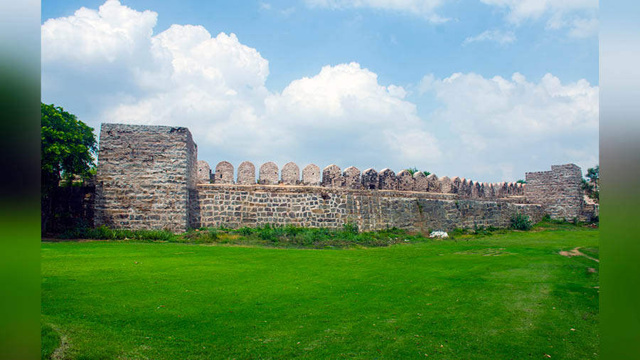 A portion of the Naya Qila wall topped with battlements 