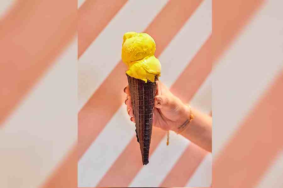 Alphonso Mango Sorbet in a Charcoal Waffle Cone: Here is a refreshing and unique dessert that combines Alphonso mangoes with the earthy and smoky taste of charcoal. The dessert features a scoop of creamy and smooth Alphonso mango sorbet, served in a crispy and crunchy charcoal waffle cone.