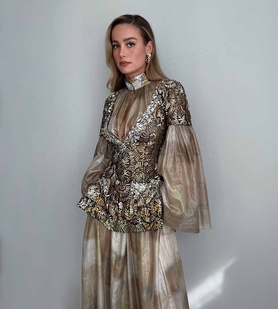 Brie Larson opted for a dull gold Chanel gown with an embellished top and flared organza sleeves. 