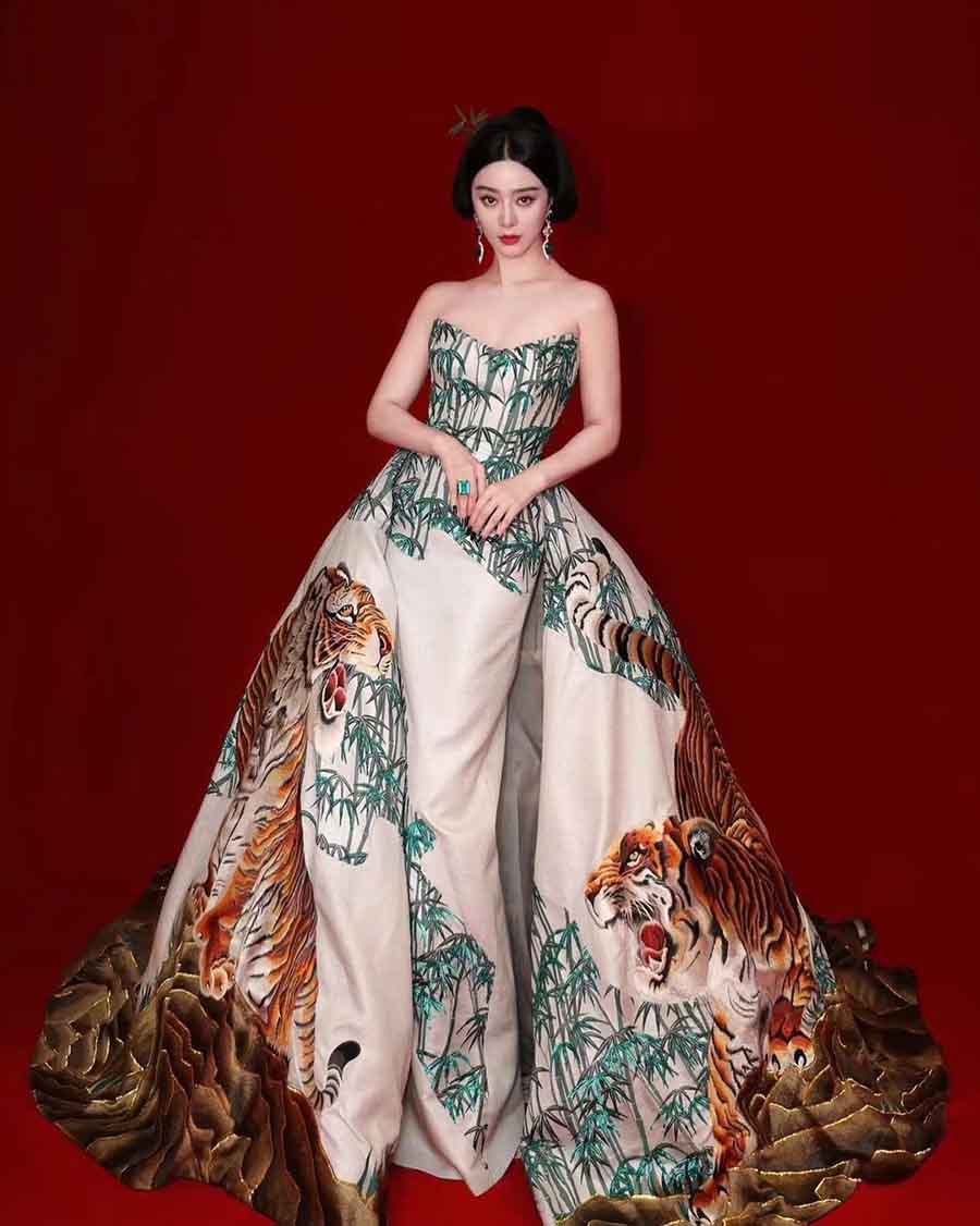 Chinese actress Fan Bingbing wore a forest-inspired graphic print Christoper Bu ball gown with a sweeping train. Emerald earrings and a ring completed the look. 