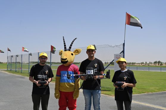 Students of BPDC with the drone at the Sanad Academy Dubai during the Pico Satellite Launch.