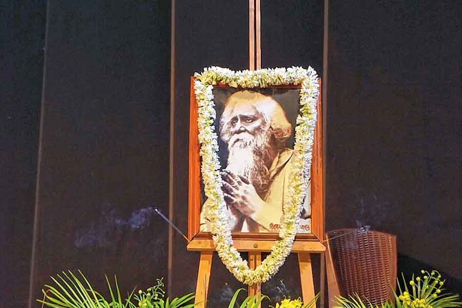 A photo of Tagore garlanded at EZCC