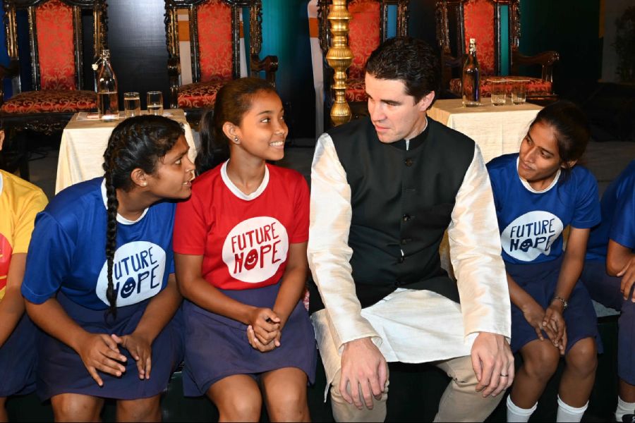 Students of Future Hope chat with Australia’s assistant minister of foreign affairs, Tim Watts, at the Australian consulate in Kolkata on Thursday          