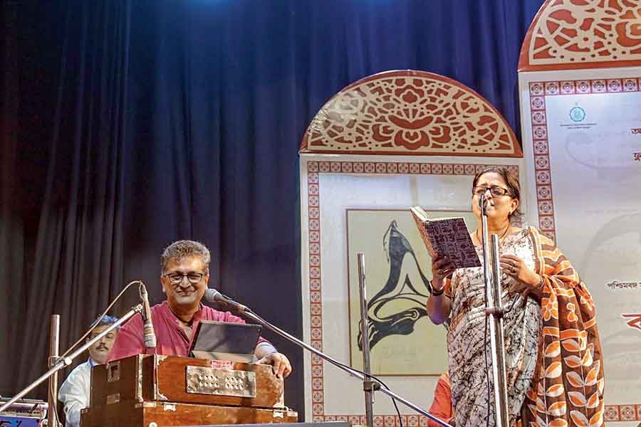 Manoj Murali Nair plays the harmonium as Manisha Murali Nair sings