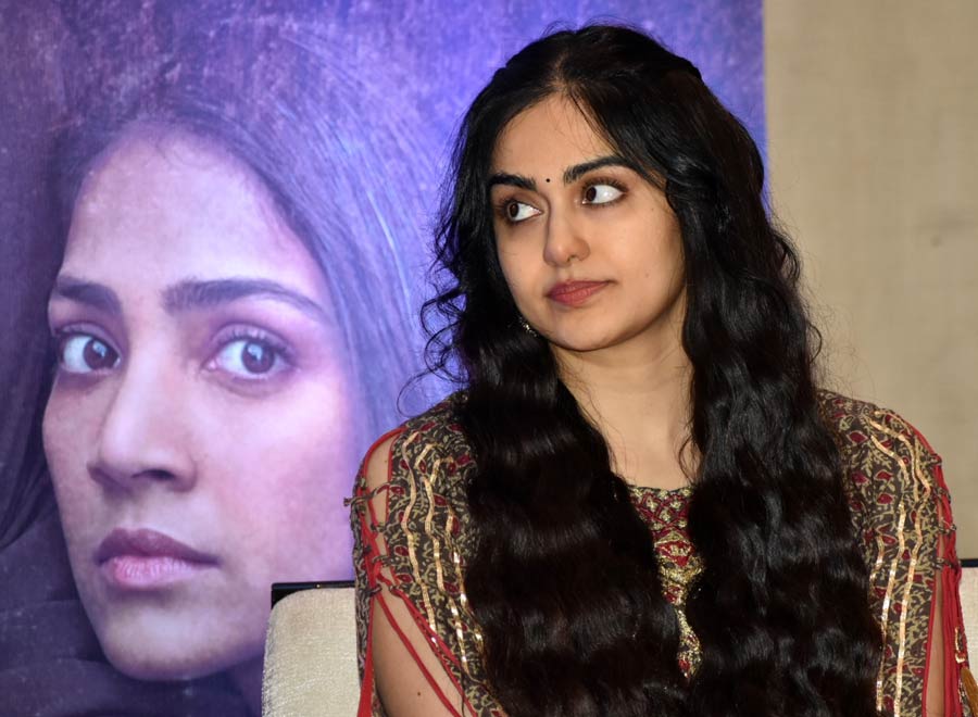 In the film, Adah plays Shalini Unnikrishnan, a nursing student known as Fatima Ba after her conversion. 