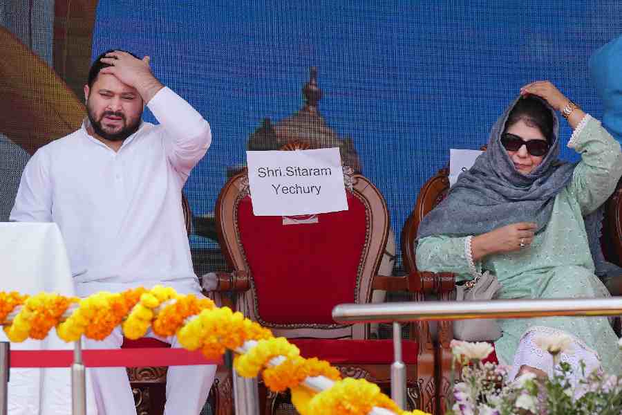 Bihar deputy Chief Minister Tejashwi Yadav and PDP Chief Mehbooba Mufti during the swearing-in ceremony of Congress government, at Kanteerava Stadium in Bangalore