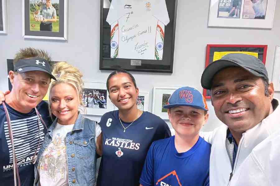 (L-R) Dave Herman, Dave’s wife Kristen, Aiyana, Dave and Kristen’s son and Leander’s godson, Cayden, in Orlando, Florida, clicked during Leander’s recent trip to celebrate Aiyana’s birthday. Leander’s seventh Olympic jersey is a shining presence