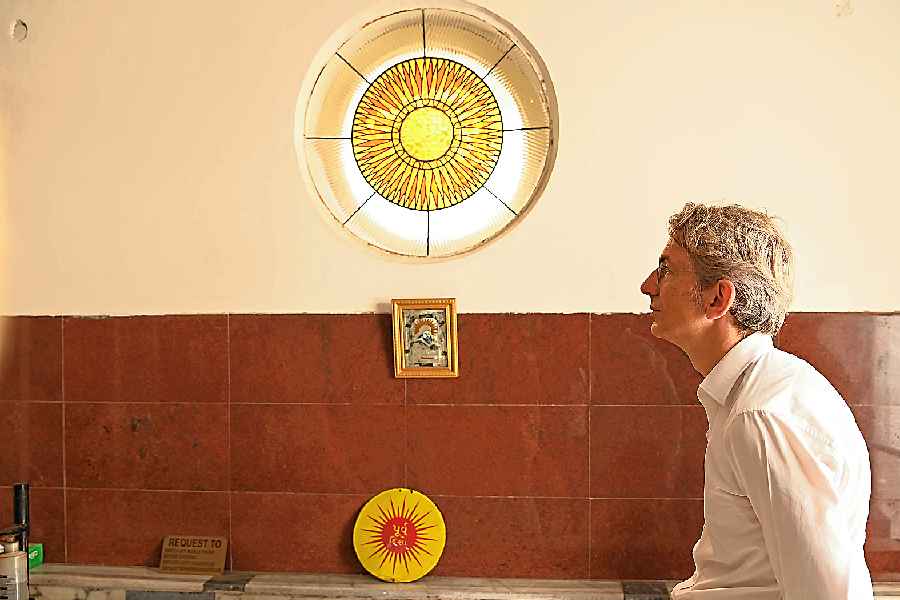 A stained glass painting at the Parsi fire temple. The sun on a wall indicates the direction of the rising sun for the devotees to face and do their ablutions