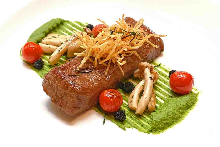 Lamb Loin: While most menus have tenderloin, chef Aina has come up with a simple yet juicy lamb loin that’s grilled and served on a bed of a simple pea purée along with sautéed Shimeji mushrooms.