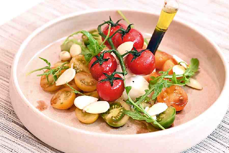 Exotic Tomato Caprese: This is a summery take on the Caprese salad with green and purple exotic tomatoes and pickled almonds. Olive oil and balsamic dressing keep it light and flavourful. Each type of tomato adds a different flavour profile.