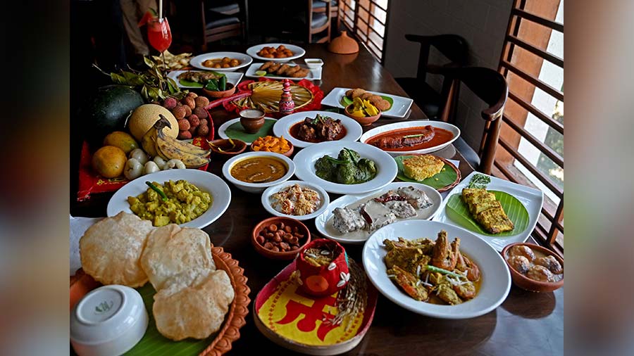 The Jamai Bhog spread and meal box has a selection of festive Bengali dishes like Chingri Shorshay Narkol, Kosha Mangsho and more