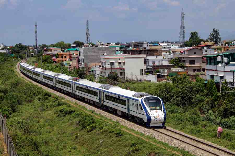 Newly flagged-off the Delhi-Dehradun Vande Bharat Express train runs on its track, in Dehradun