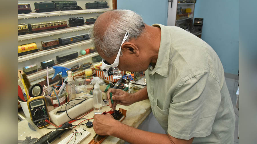 Bansal has a workstation to repair the toy trains’ damaged parts 