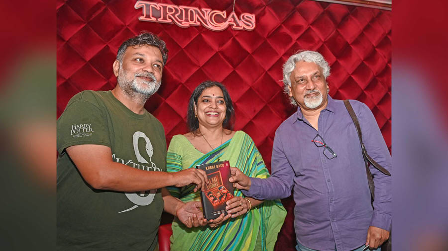 Kunal Basu (right) with Srijit Mukherji and Malavika Banerjee at the launch of his latest anthology, Filmi Stories, at Trincas
