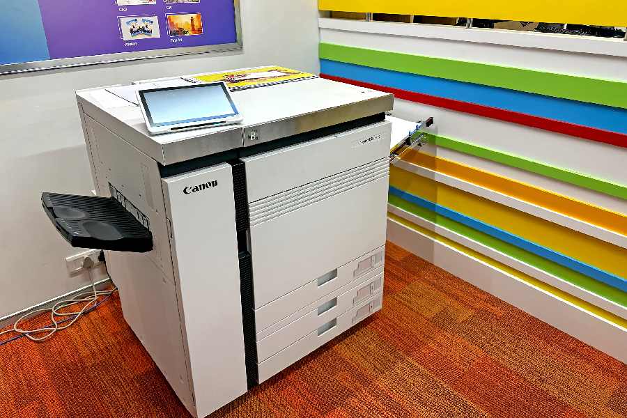 A Canon office printer in action