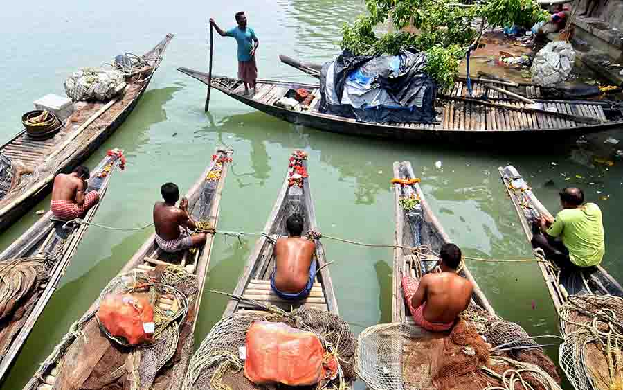 Fishermen worship their boats on the occasion of Ganga Dussehra festival at Kolkata’s Babughat on Tuesday  