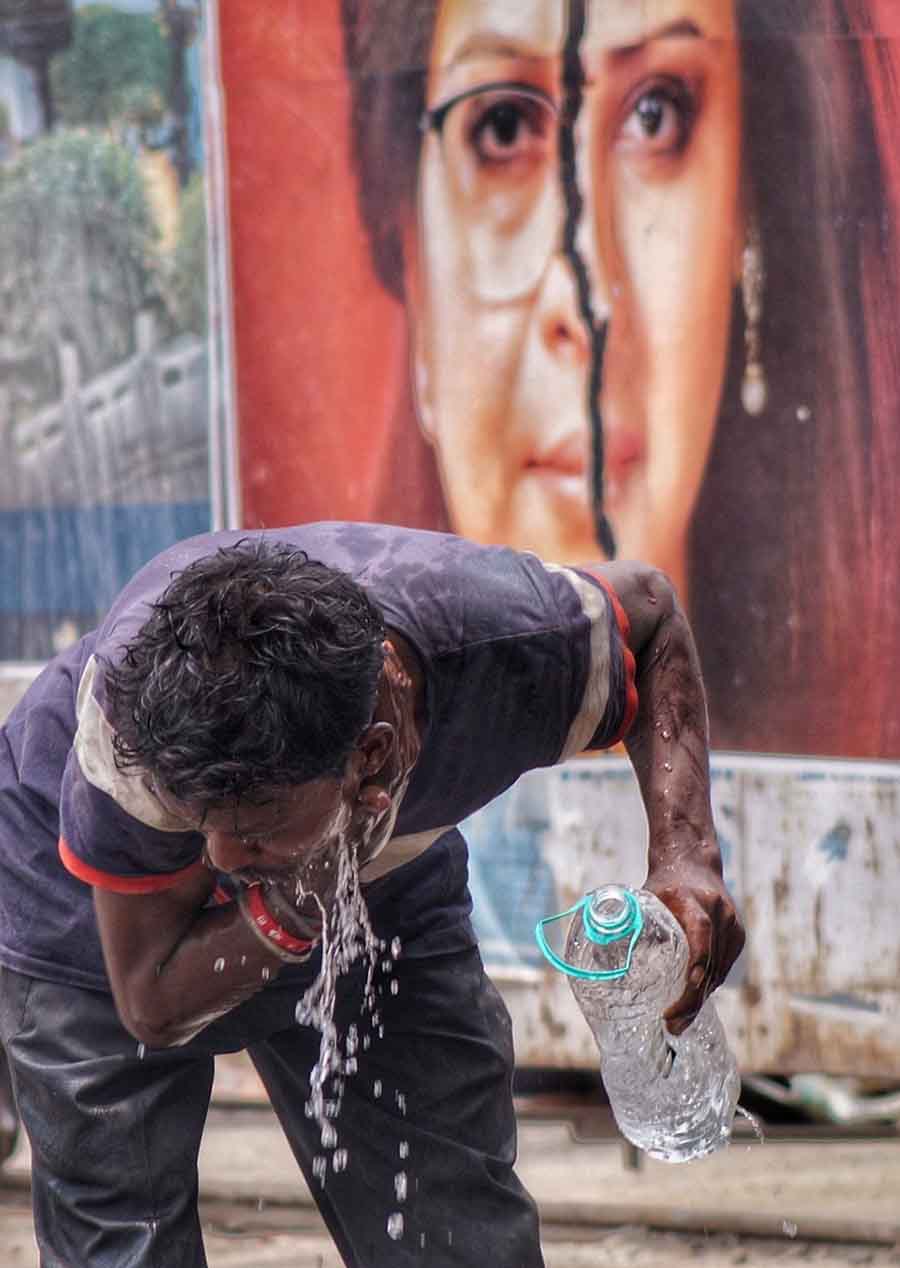 A man splashes water on his face at Esplanade for some relief from the hot and sultry weather. The maximum temperature soared to 37°C in Kolkata on Tuesday 