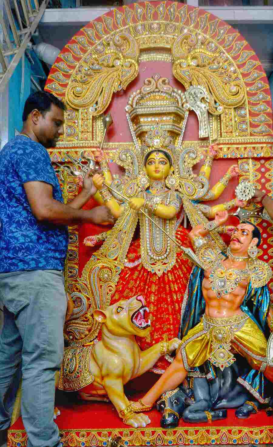 With 143 days to go for Durga Puja, idol-makers at Kumartuli are already busy completing Durga idols to send off to faraway lands. In picture, artist Kaushik Ghosh puts the finishing touches to an idol that will be travelling to London 