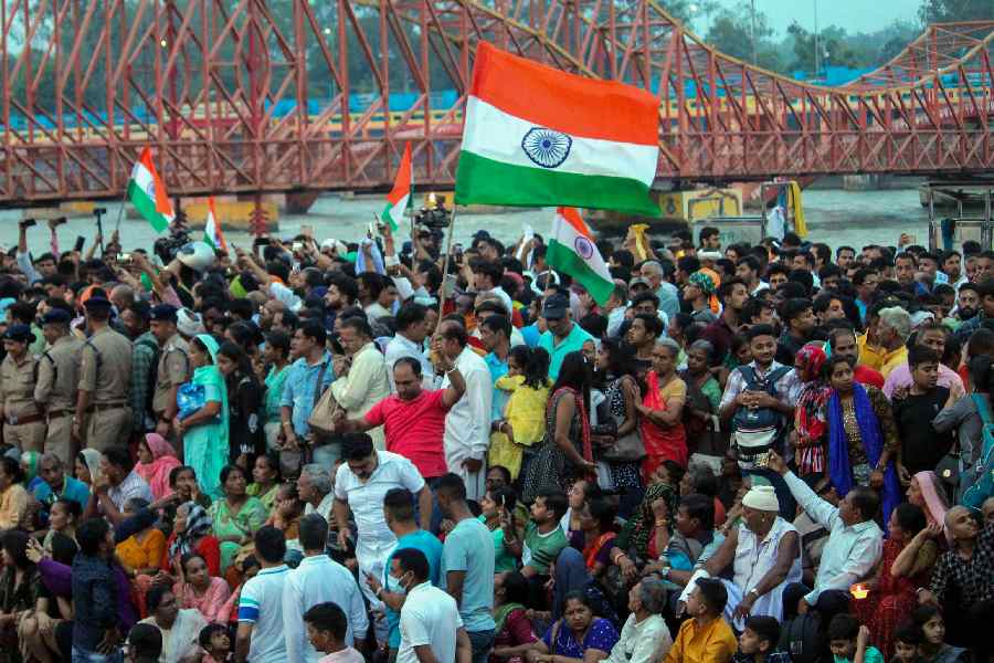 Supporters gather at Har Ki Pauri ghat where protesting wrestlers arrived to immerse their medals in the Ganga river as a mark of protest against WFI chief Brij Bhushan Singh over sexual harassment allegations, in Haridwar.