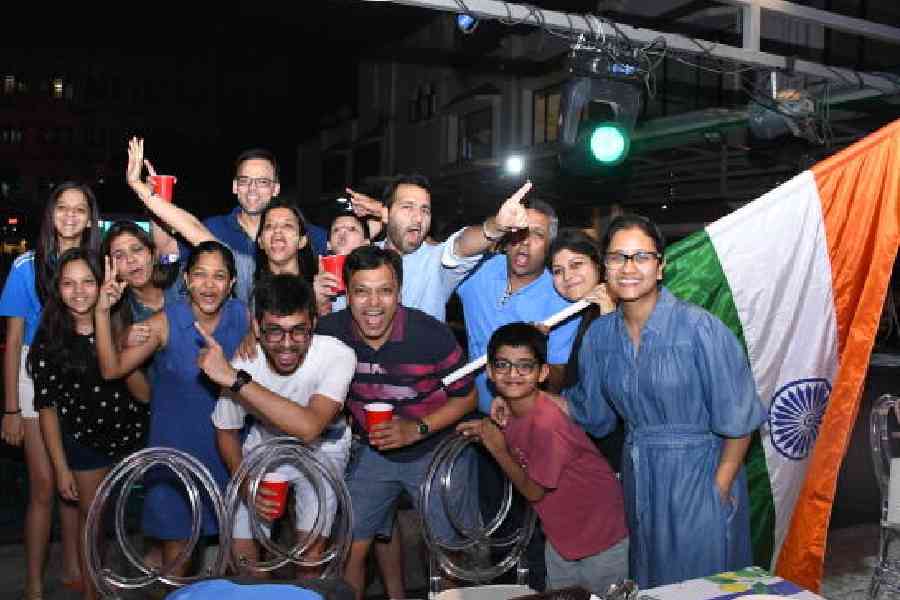 Club members posed for a photo after the historic win of India in a nail-biting game against Pakistan
