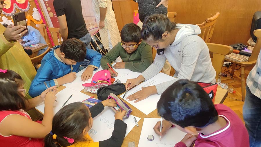 Activities such as sit-and-draw competitions keep the children occupied after the evening ‘arati’