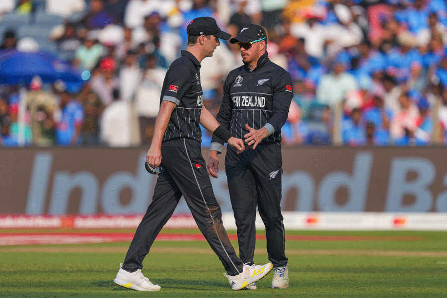 Matt Henry (left) leaves the field after suffering cramps during New Zealand’s match against South Africa in Pune on Wednesday.