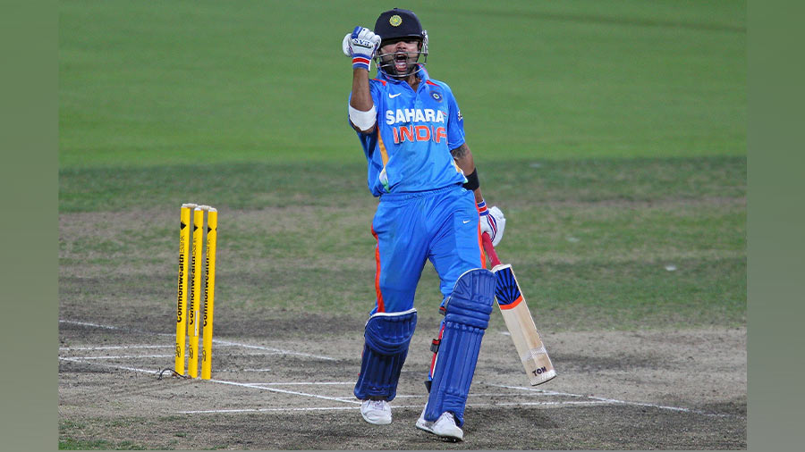 Kohli celebrates after sealing a memorable chase for India against Sri Lanka in Hobart in 2012