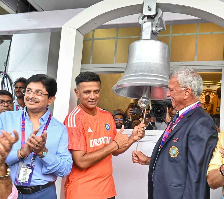 India coach Rahul Dravid and Board of Cricket Control in India Roger Binny ring a ball to declare the start of the 37th match of the ICC Men’s World Cup 2023 at the Eden Gardens on Sunday. With them is Snehasish Ganguly, president of the Cricket Association of Bengal   