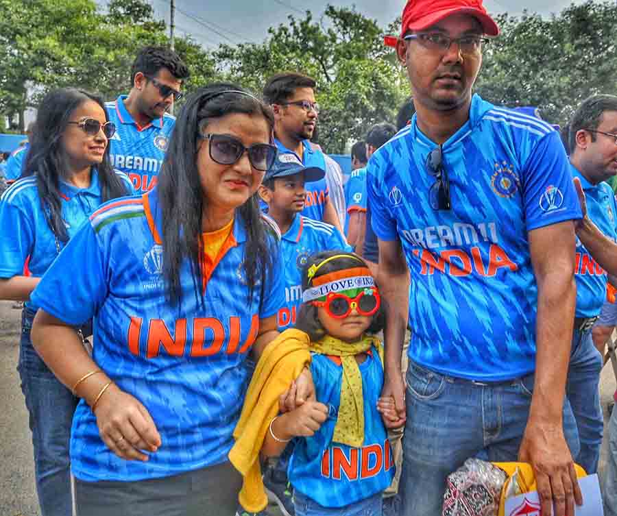 Excitement in their hearts, supporters all geared up in team jerseys rush towards the Eden Gardens ahead of the big game between India and South Africa 