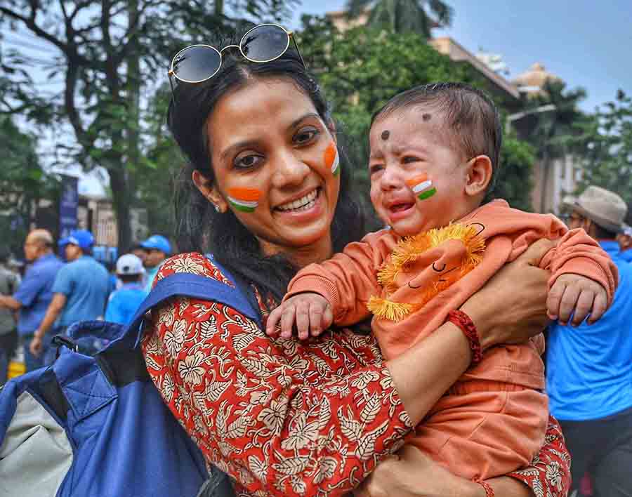 The youngest supporter of Team India with the Tricolour on the cheeks doesn’t seem too happy to be in the crowd. Did the Indian players manage to turn on his smile?