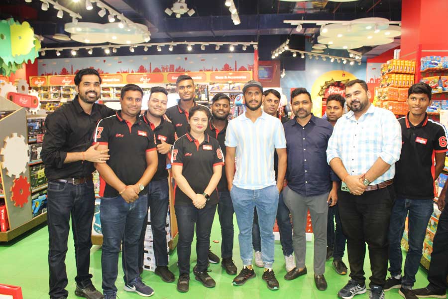 Hassan Ali with the staff of Hamleys 