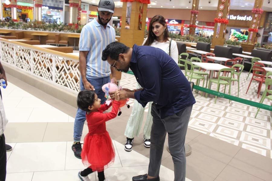 Little Helena received a toy from the South City Mall staff