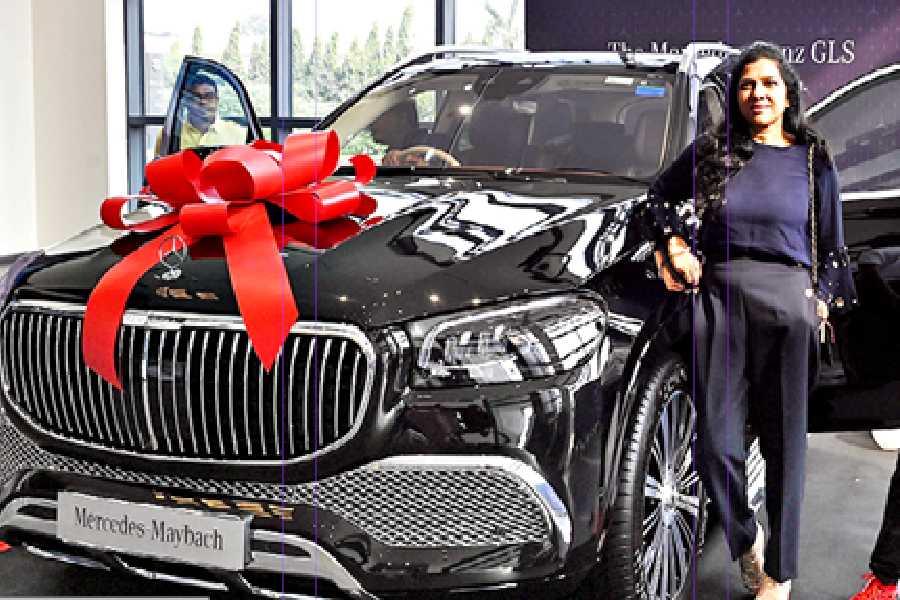 ﻿ Anita Singhania and son Aanesh, residents of Ballygunge Circular Road, with their new black Mercedes-Maybach GLS SUV on Friday.