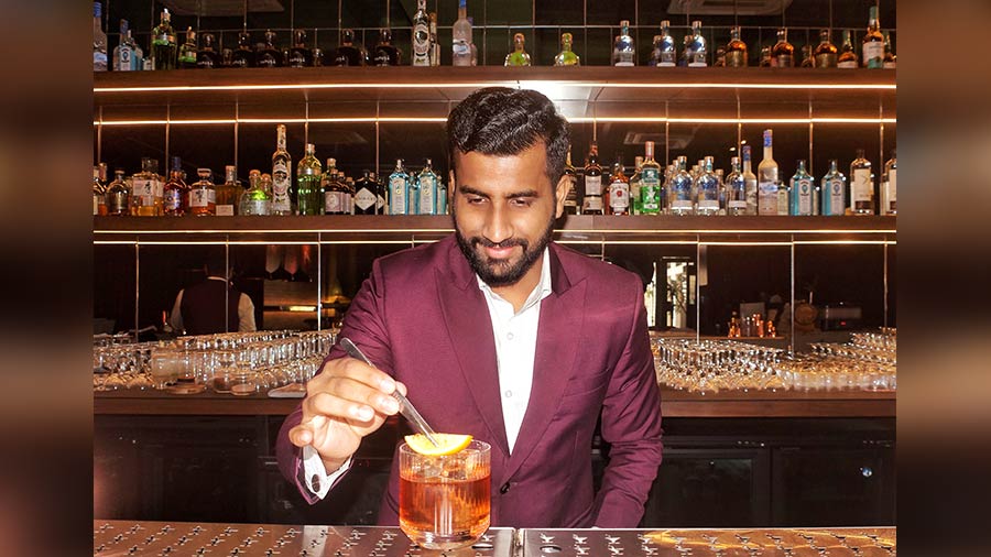 Md Shabaz Alam, the GM and chief bar master of Little Bit Sober, serves up a Caramel Old Fashioned