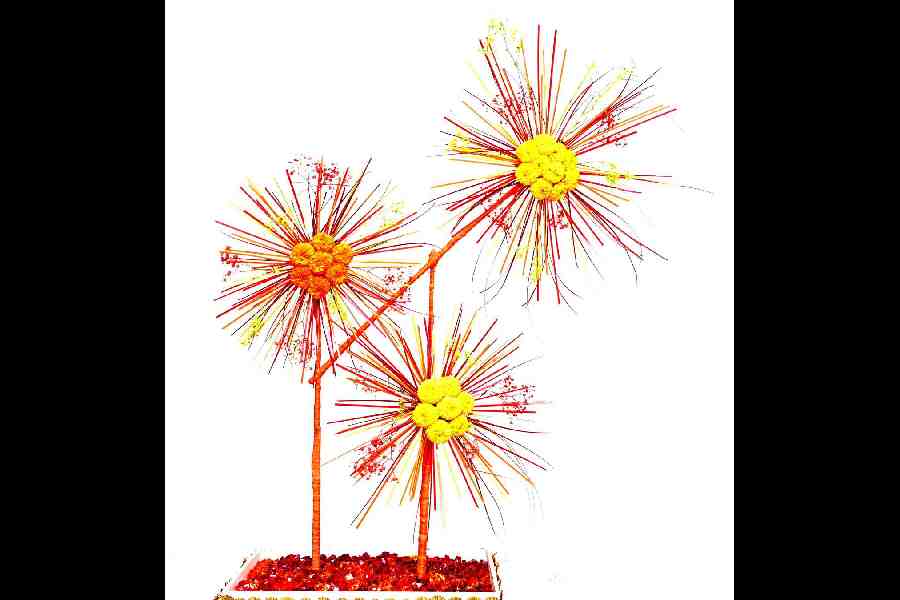 Witness the celestial depiction of crackers in the sky, a creation from my past world show. Marigolds take centre stage, surrounded by the delicate embrace of baby's breath