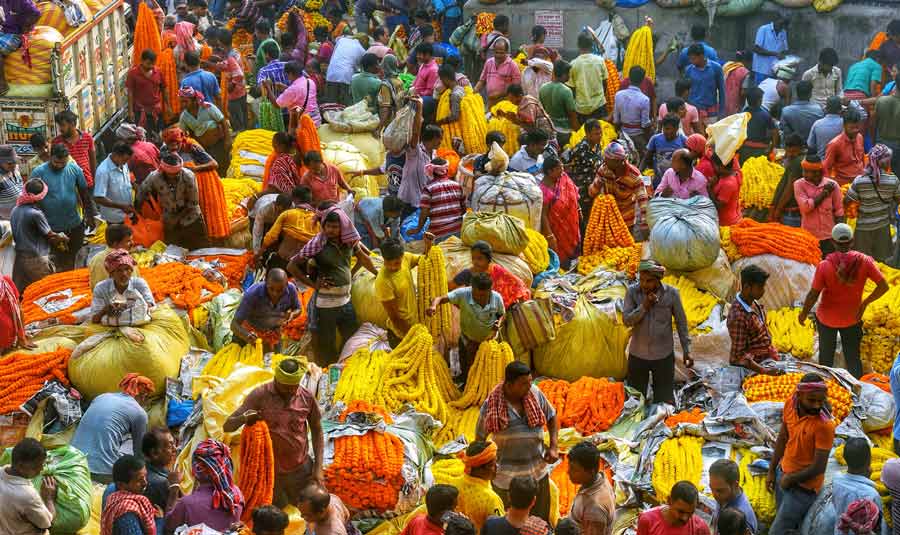 A busy Mullick Ghat flower market in Howrah on Diwali and Kali Puja morning  