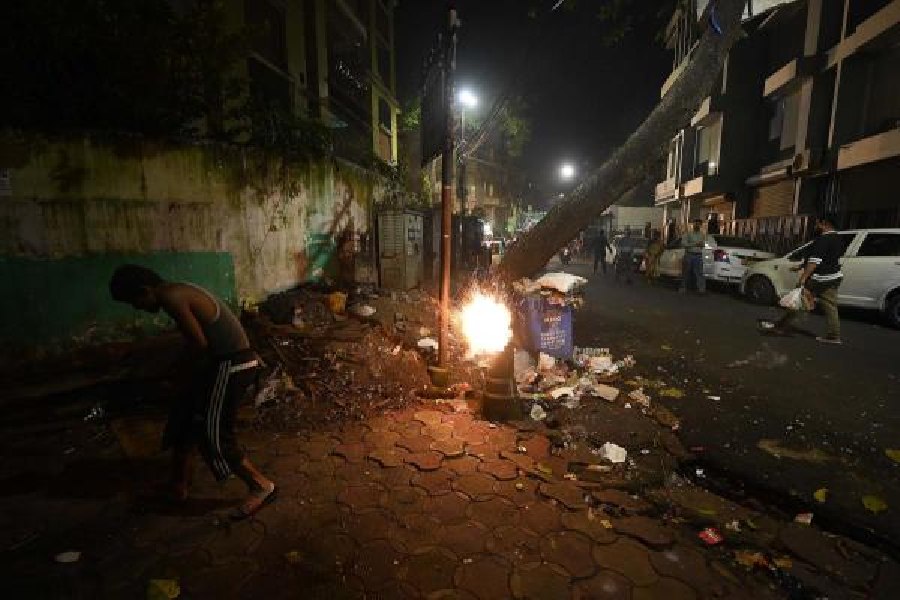 A sound-emitting firecracker being lit in Bhowanipore at 7.45pm on Sunday. According to a court order, firecrackers can be burst only from 8pm to 10pm on Diwali