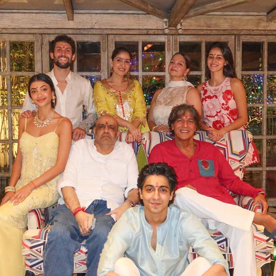 Ananya Panday went for a red-floral kurti and posed for a family photo with her father Chunky Panday, Bhavana Panday and her cousins Alanna and Ahaan Panday.
