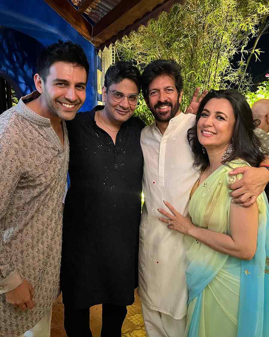 Dil Bechara director Chhabra Mukesh and Kartik Aaryan pose with Kabir Khan and his wife Mini Mathur at a Diwali party. 