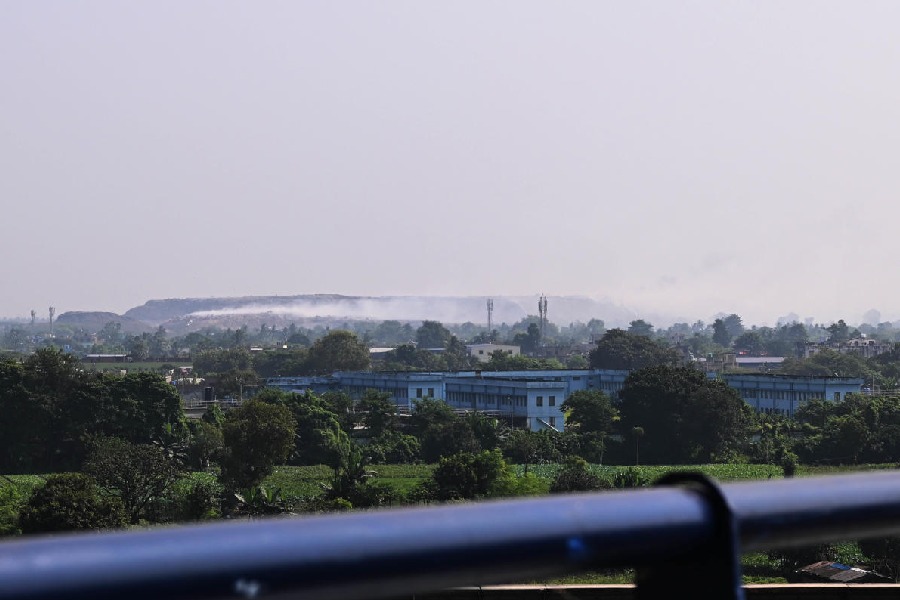 Smoke rises from the Dhapa waste disposal ground on Monday afternoon.
