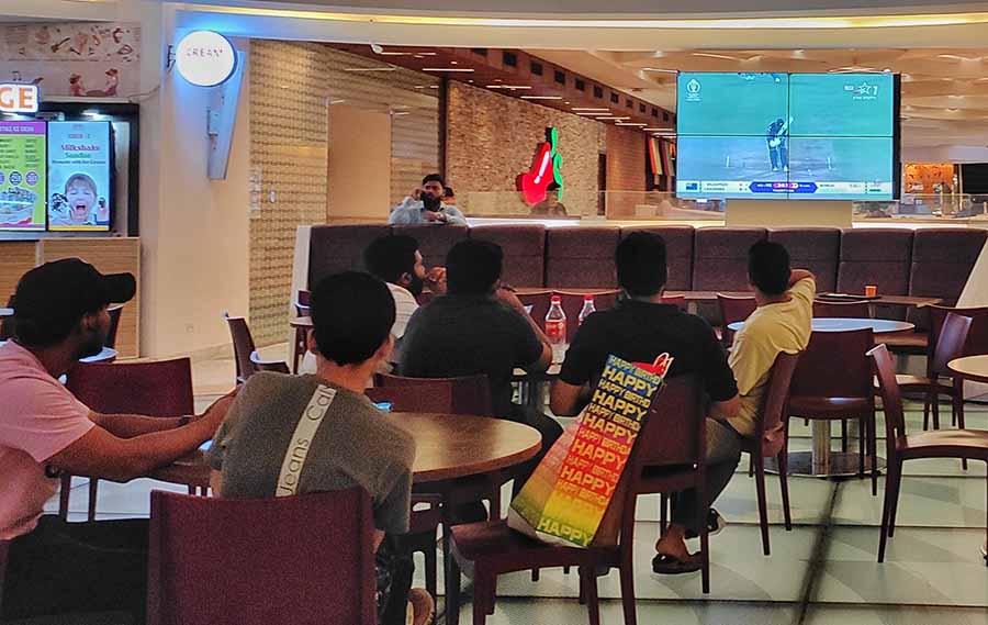 Visitors at Quest Mall took a break in the food court to watch India bat its way up to a score of 397
