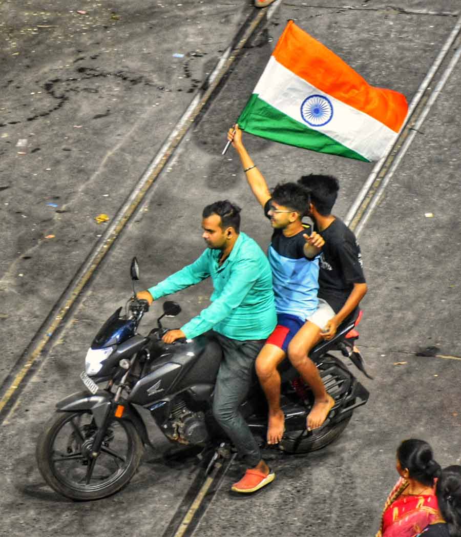 A fluttering Tricolour held aloft by bikers in Bagbazar on Wednesday night