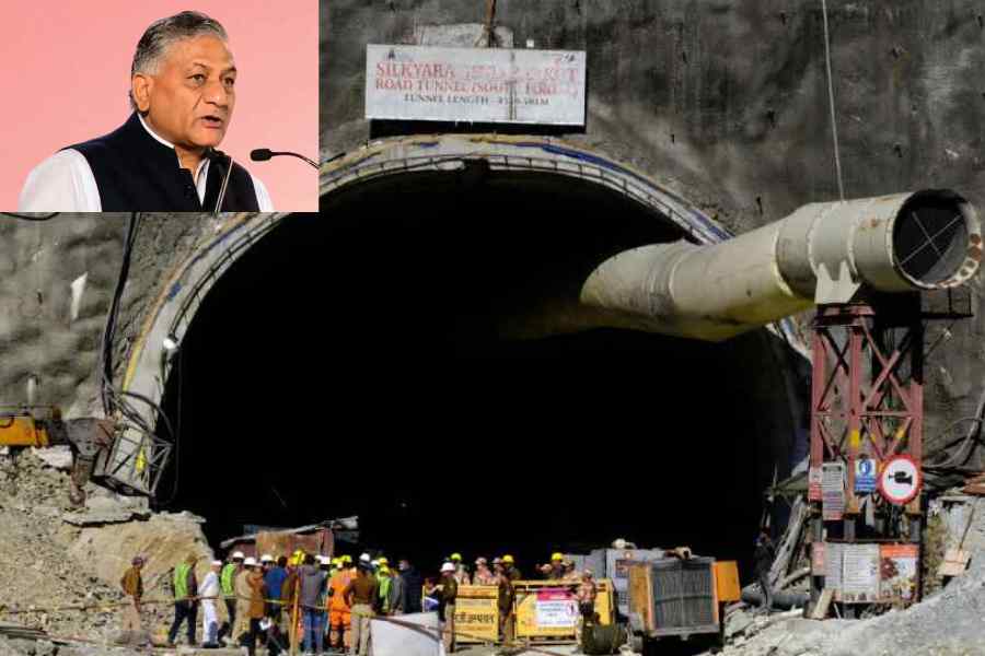 Members of rescue teams on Thursday stand at the entrance to the Uttarakhand tunnel where labourers have been trapped since a portion of it collapsed.