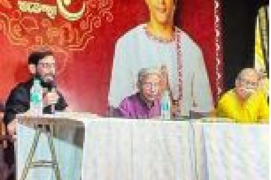 Orator Chandril Bhattacharya and (right) poet Binayak Bandopadhyay on the CG Block stage along with mdoerator Shyamal Gan