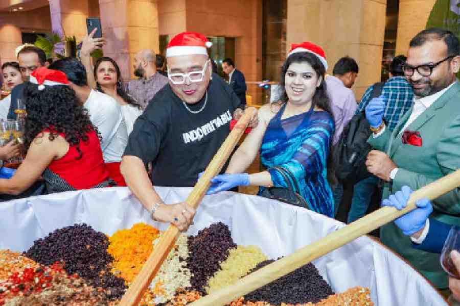 Guests armed with mega-sized ladles took part in mixing and soaking of the different treats and berries. These soaked goodies will make their way into the hotel's seasonal Christmas cake.