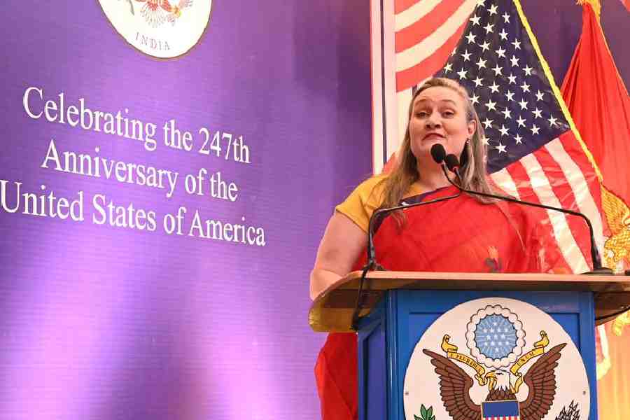 Consul general Melinda Pavek addresses the gathering dressed in a handspun red sari